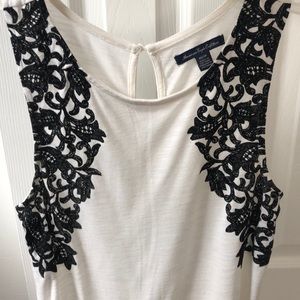 White tank top with black felt floral design